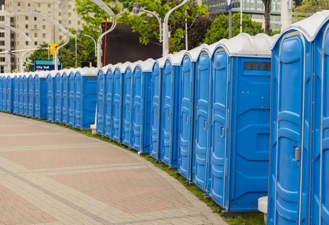 a row of sleek and modern portable restrooms at a special outdoor event in Muskogee